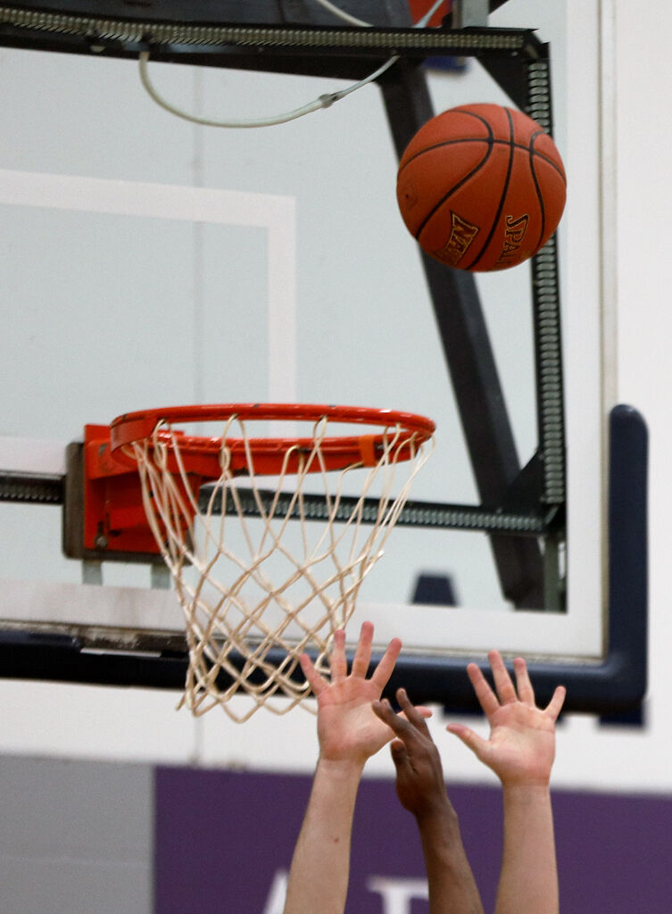 Jacob Ungles and Shackeel Butters reach for a rebound